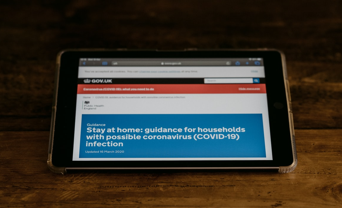 tablet screen showing government advice on coronavirus